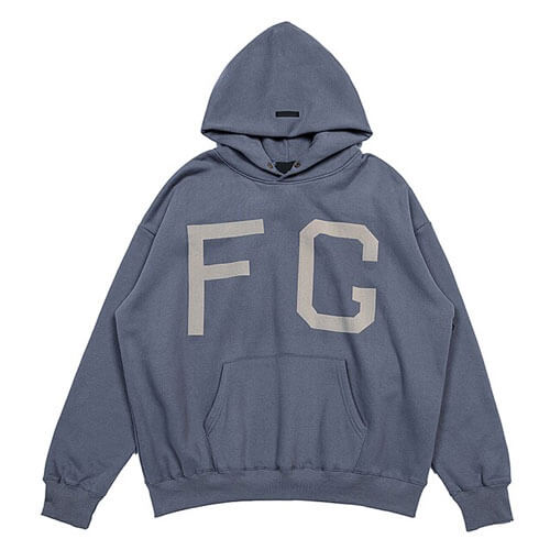 Essentials Fear of God FG 7th Collection Blue Hoodie, showcasing premium design, bold branding, and a relaxed fit, perfect for casual and streetwear styles.